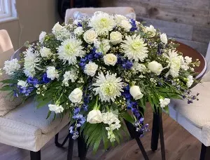 Elegant Blue and White Casket Spray